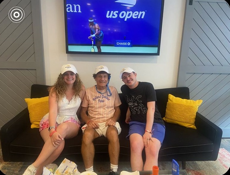Dr. Marshall Hubsher with his son and daughter in the Amex Center Court Suite